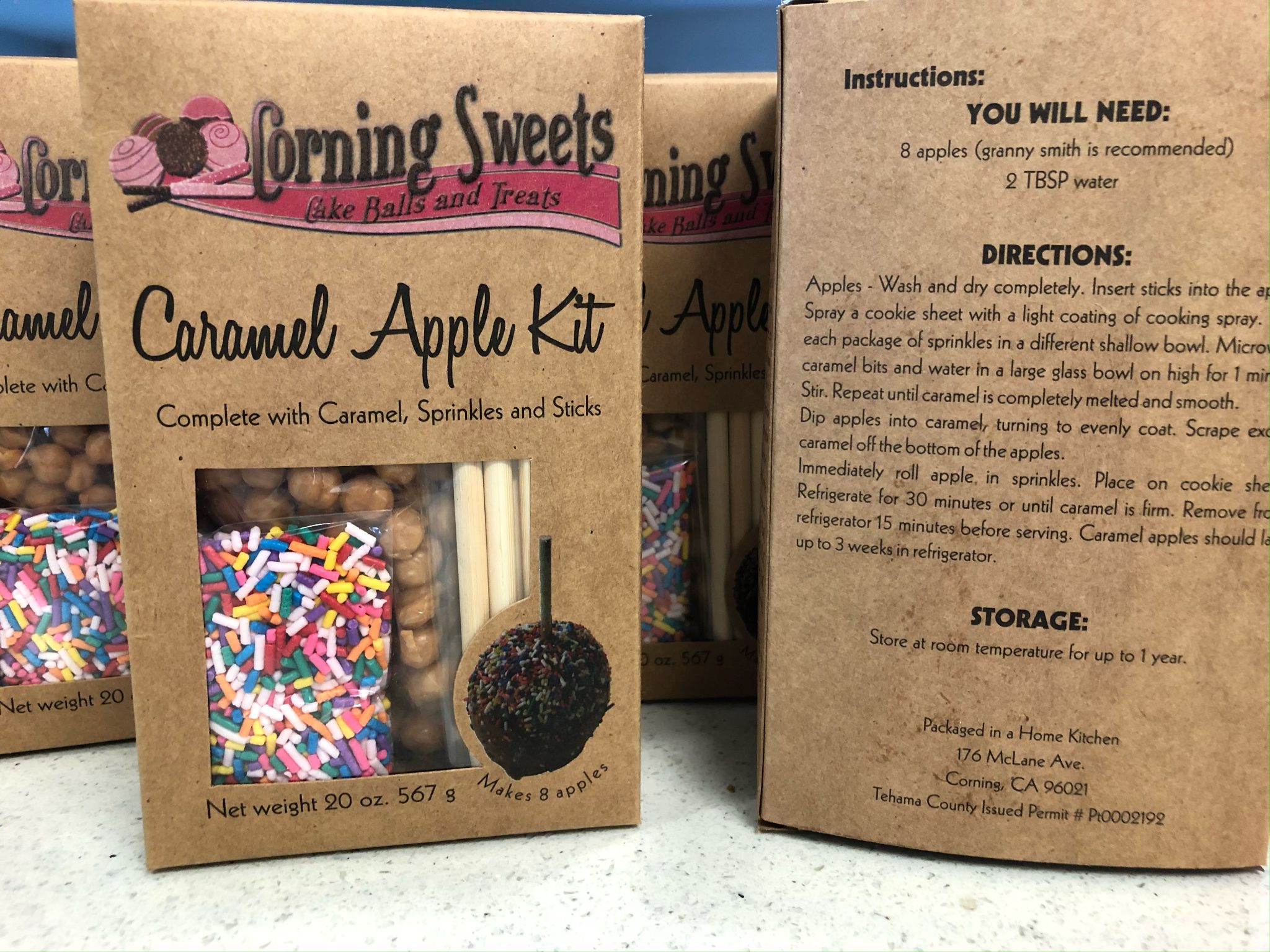 Boxed Corning Sweets Caramel Apple Kits complete with caramel, sprinkles, and sticks
